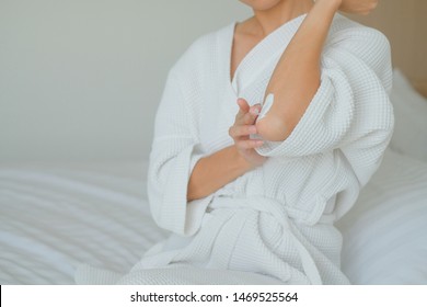 Woman Applying Elbow Cream,lotion , Hygiene Skin Body Care Concept.