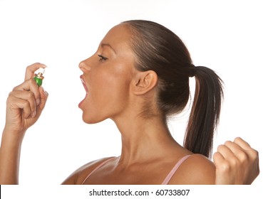 Woman Applying Fresh Breath Spray