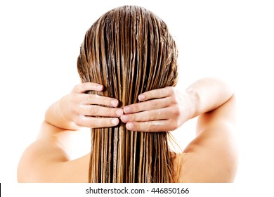 Woman Applying Hair Conditioner. Isolated On White.