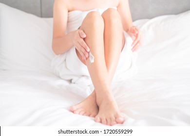 Woman Applying Legs Cream,lotion , Hygiene Skin Body Care Concept.
