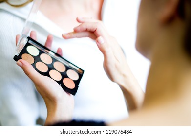 Woman Applying Makeup.