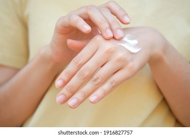 Woman Applying Moisturizing Hand Cream, Concept Of Health Care Of The Hand.