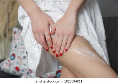 Woman Applying Skincare Product On Her Legs At Home. Domestic Life, Home Spa, Skin Care And Pampering Concept.	