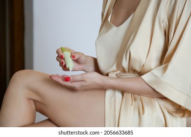 Woman Applying Skincare Product On Her Legs At Home. Domestic Life, Home Spa, Skin Care And Pampering Concept.	