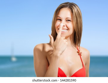 Woman Applying Sun Screen On Her Nose