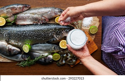 The Woman In An Apron Pickles Assorted Fresh Fish And Shrimp