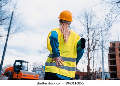 Woman Architect Feeling Backpain On Her Back And Hip, Suffering From Injury On Work. Female Massaging  Her Back