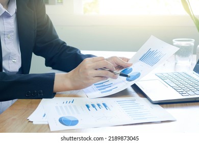 Woman Arm Holding Silver Pen Point In Marketing Financial Graph Solving. Situation Examination At Board Council Sale Adviser Job Stock Exchange Market Profit.