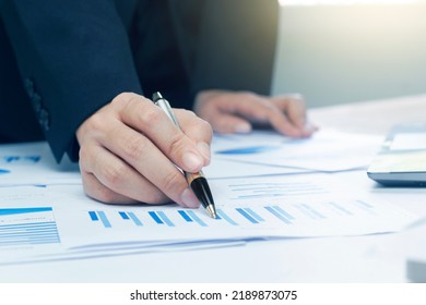 Woman Arm Holding Silver Pen Point In Marketing Financial Graph Solving. Situation Examination At Board Council Sale Adviser Job Stock Exchange Market Profit.