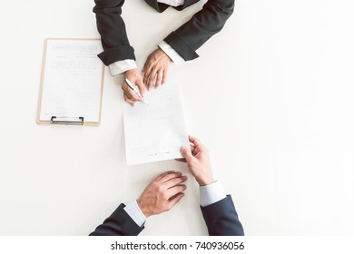 Woman arm putting signature on document - Shutterstock ID 740936056