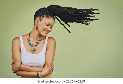 Woman, arms crossed and dreadlocks in studio background for fashion, stylish clothes and cool look. Female model, jewelry and trendy accessory by mockup space for hipster, dancing and confidence - Powered by Shutterstock