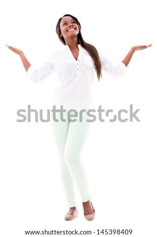 Photo of attractive young female shows something very little or tiny,  gestures with hand, isolated over white background in studio. Its too small  Stock Photo