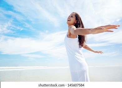 Woman With Arms Out Carefree Healthy Summer Lifestyle On Holiday