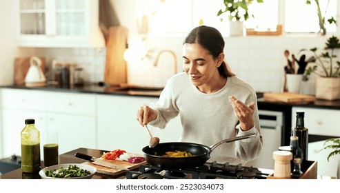 Woman, aroma and kitchen as chef or nutritionist as diet or recipe in home with satisfaction. Female person, culinary art for gourmet cuisine, creative or cooking for meal preparation, dinner or food - Powered by Shutterstock