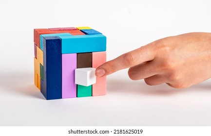 Woman Arranging Puzzle Cube By Putting Missing Element. Construction Last Stage, Decision Making Process. Kids Or Family Toy For Intelligence, Logical Thinking, Creativity Development. Photo