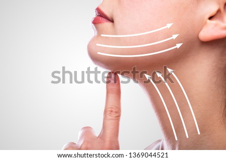 Woman With Arrows On Her Face Over White Background