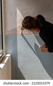 Woman Artist Painting Mural With Brushes