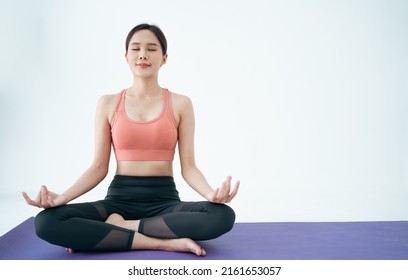 Woman Asian Group Beautiful Young Yoga Sports Woman Doing Exercises And Doing Yoga Fitness,Short Meditation,sport And Healthy Lifestyle. People Stay At Home Healthy Concept.