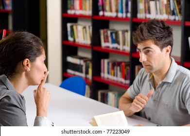 Woman Asking Her Partner To Be Quiet In The Library