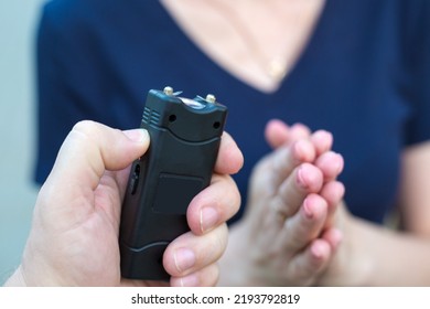 Woman Asking For Mercy Front Of A Criminal With A Stun Gun.