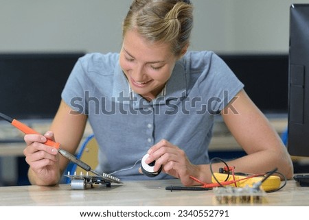 woman and assembly of electronic devices