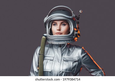 Woman astronaut wearing space helmet and suit
