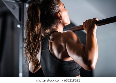 Woman Athlete Doing Pull Ups