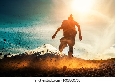 Woman athlete runs on a dirty and dusty ground with volcano on the background. Trail running athlete working out in the mountains - Powered by Shutterstock