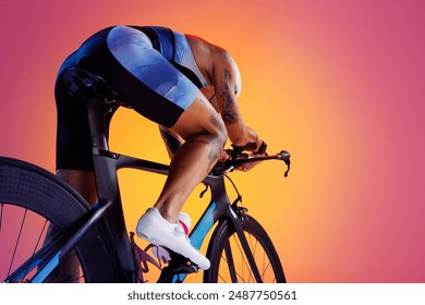 Woman, athlete in vibrant cycling attire and white helmet, leaning on road bike against gradient background in neon light. Concept of sport, competition, tournament, championship, endurance, energy - Powered by Shutterstock