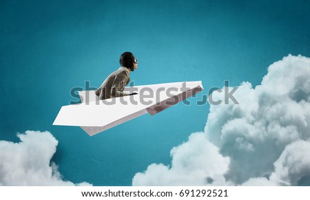 Woman Aviator floating in sky . Mixed media