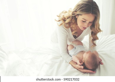 A woman with a baby  - Shutterstock ID 590217032