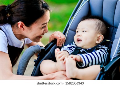 Woman With Baby In Buggy