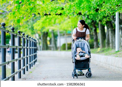 Woman With Baby In Buggy