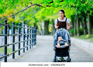 Woman With Baby In Buggy