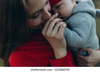 Woman And Baby In Nature. Mom And Baby Are Relaxing In The Park. High Quality Photo