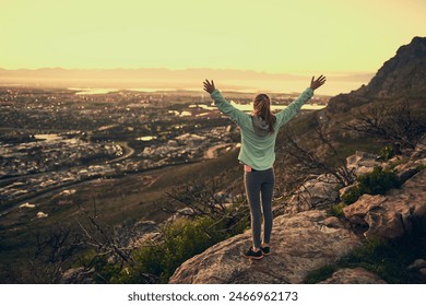 Woman, back and freedom on mountain with fitness for hiking success, exercise victory and celebration. Athlete, person and hand gesture in nature with sunrise and workout in morning with sportswear - Powered by Shutterstock