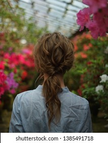 Woman Back. Messy Pony Tail Hairstyle