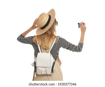 Woman with backpack taking picture on white background, back view. Summer travel