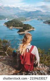 Woman backpacker enjoying lake view alone outdoor Travel adventure in Turkey active vacations healthy lifestyle eco tourism girl sitting on cliff