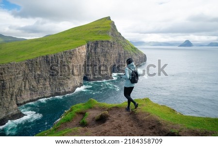 Similar – Image, Stock Photo Cliffs of Moher, woman, hiking