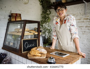 Woman Bakery Shop Owner Standing Next To Counter