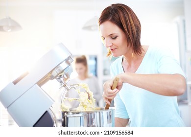 Woman Baking With Stand Mixer In Kitchen