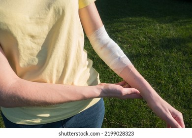 Woman With The Bandage On The Wound. Bleeding Injury Hand.