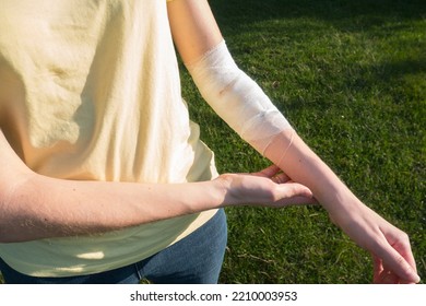 Woman With The Bandage On The Wound. Bleeding Injury Hand.