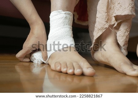 Woman with bandaged foot close up 