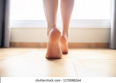 Woman Bare Feet Walking On Floor, Closeup.