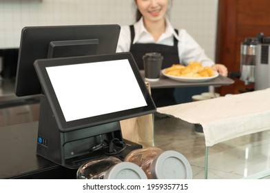 Woman Barista People In Apron Working On POS System Machine With Blank Empty Space Screen Monitor On Counter, Cafe Restaurant Cashier. Waitress In Coffee Shop. People Lifestyle. Business Service.