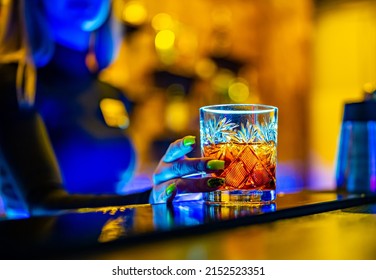 Woman Bartender Hand Making Cocktail In Nightclub