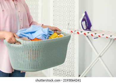 Woman with basket full of clean laundry indoors, closeup - Shutterstock ID 2193064241