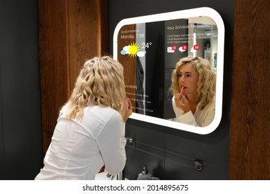 Woman In Bathroom Using Smart Mirror